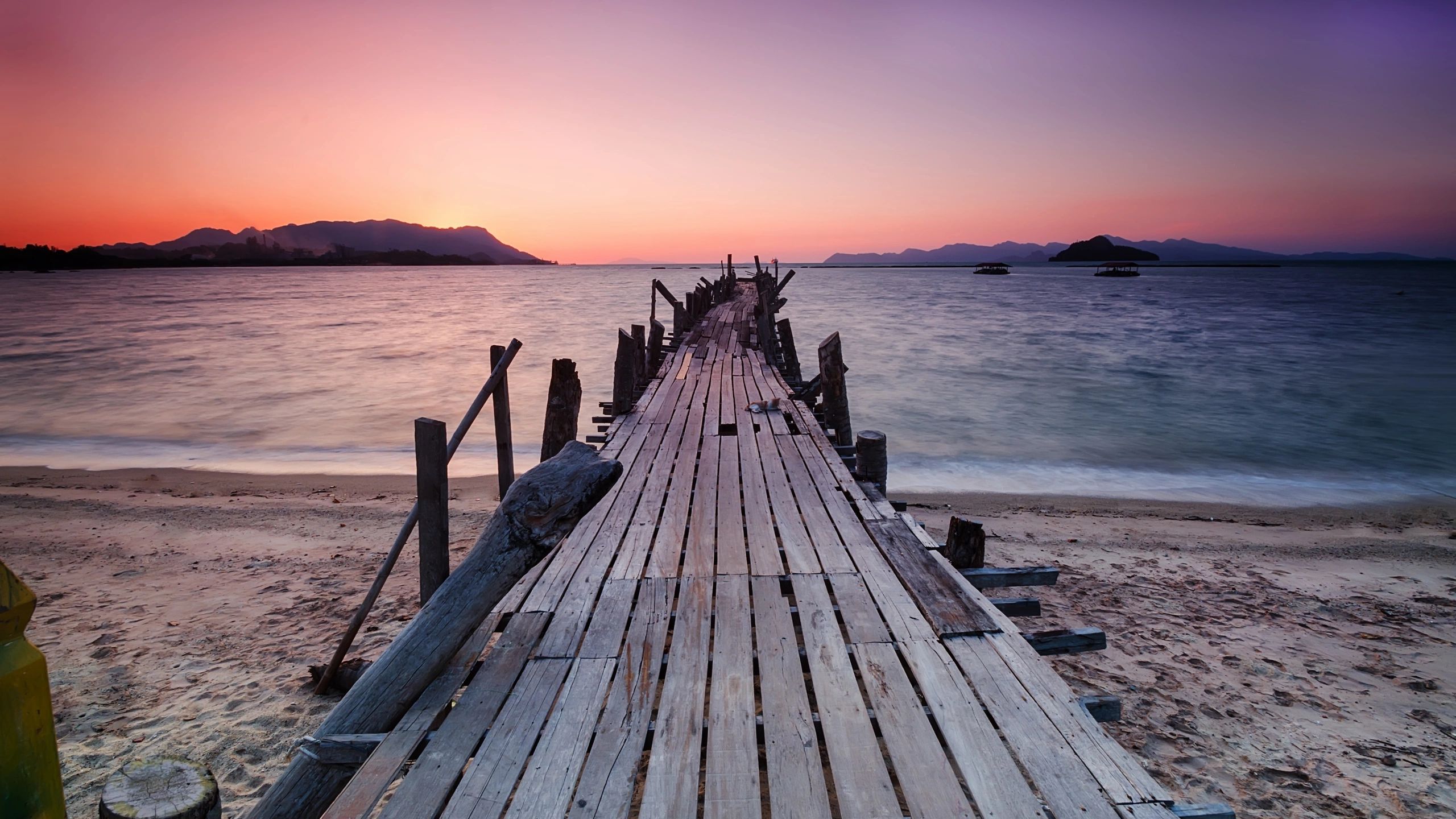 Wooden pier coastal sunset